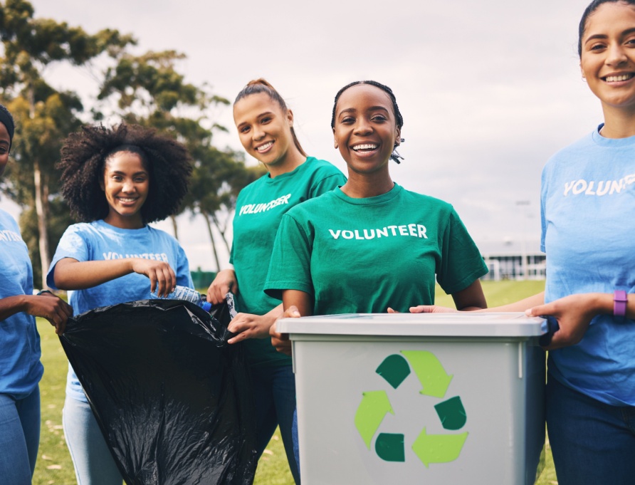 A group of women volunteering outside.