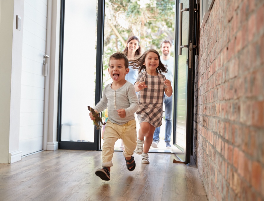 Children running through the front door.