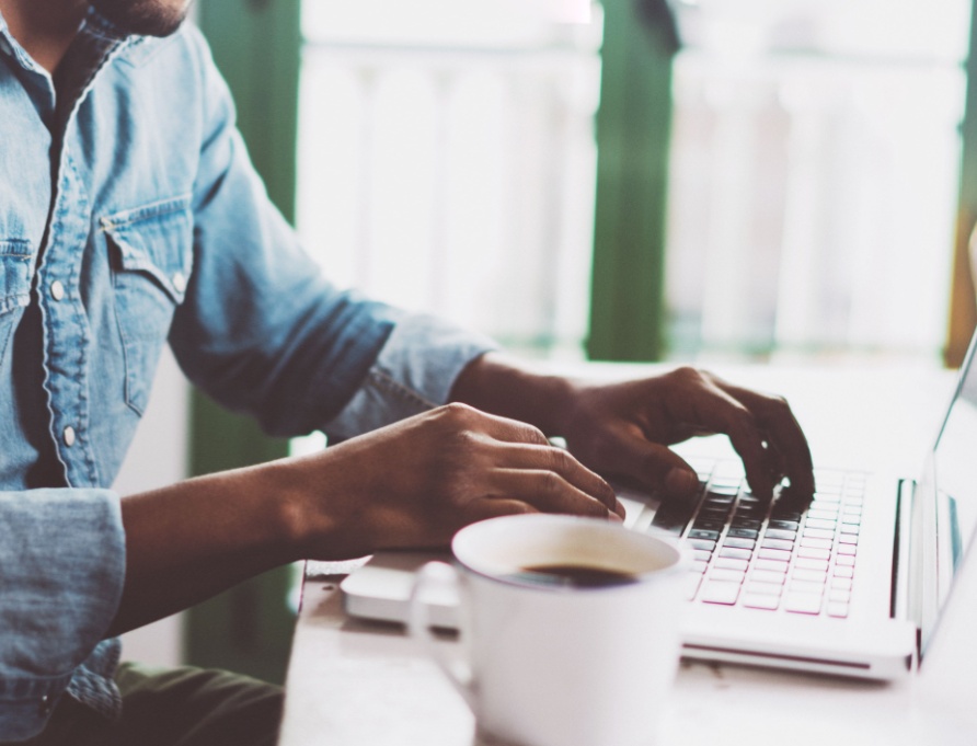 A man working from home on a laptop.