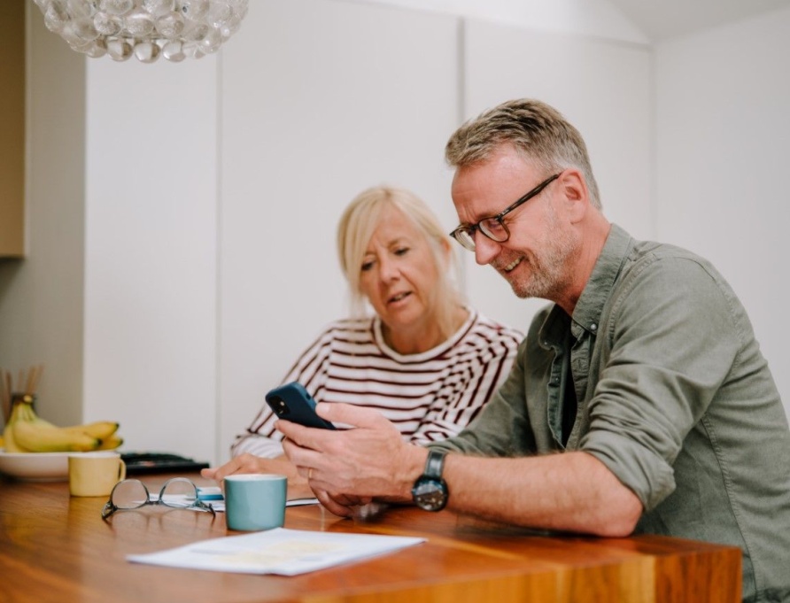 A couple going through paperwork together.